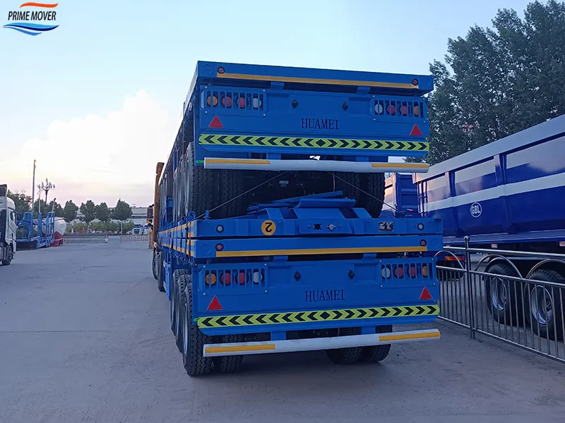 Blue Chassis Flatbed Trailer Being Loaded and Shipped