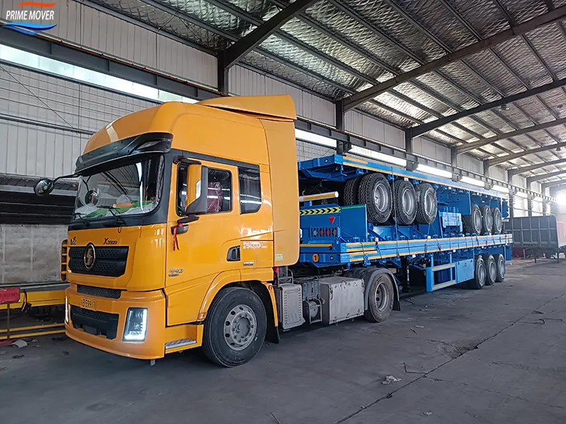 Three Flatbed Trailers Being Shipped