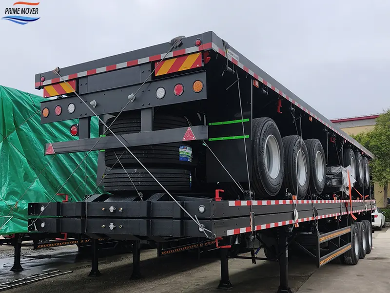 Loading Completed for the Three-Axle Flatbed Trailer with Front Axle Airbag Lift Loading Completed for the Three-Axle Flatbed Trailer with Front Axle Airbag Lift