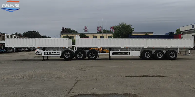 Full Side Profile Shot – White 6-Axle Double Compartment Low-Sided Semi-Trailer at Logistics Yard Full Side Profile Shot – White 6-Axle Double Compartment Low-Sided Semi-Trailer at Logistics Yard