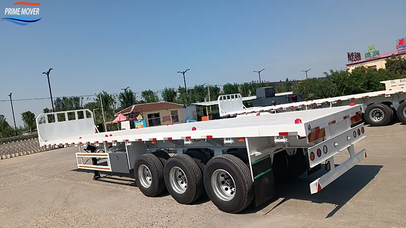 Flatbed trailer transporting heavy cargo across border for cross-border logistics